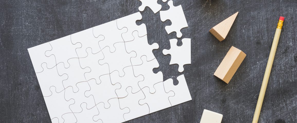 puzzle-with-shapes-pen-blackboard